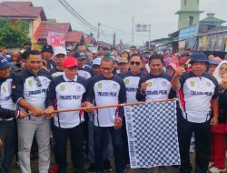 Hujan Tak Halangi Ribuan Warga Tanjung Palas Meriahkan Jalan Santai HUT RI ke 80